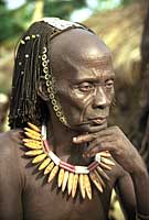 Image: Lega man wearing the hat and necklace of a Bwami society elder, near Kalima, Democratic Republic of the Congo
